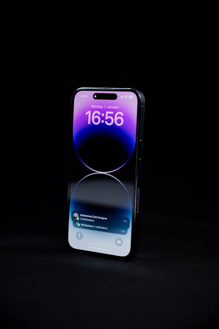 Sleek smartphone with digital notifications displayed on black backdrop. Ideal for tech and lifestyle themes.